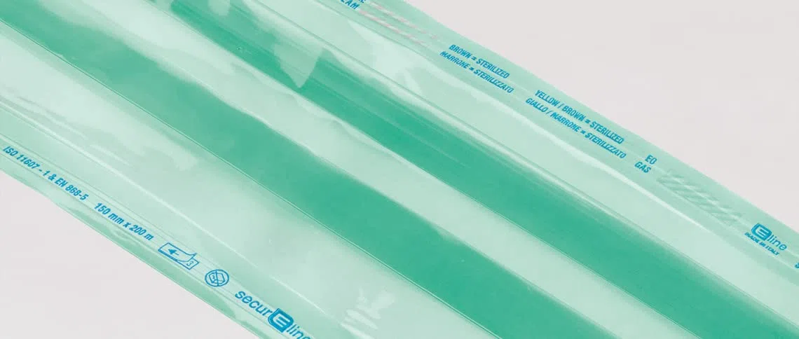Eline - Gaines Gusset pour Stérilisation à la Vapeur ou ETO en Papier Kraft et Film Médical Soudure Latérale Renforcée, Indicateurs Colorés, Mesures 300 x 40 mm, 1 Rouleau de 100 m